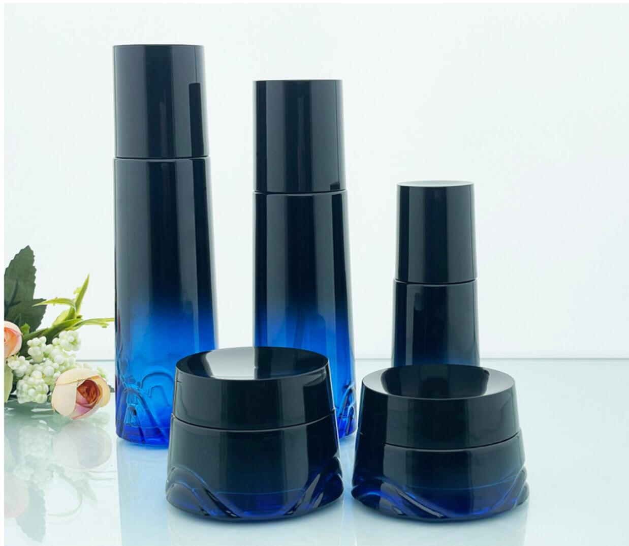 high quality luxury drak blue cosmetic glass bottle set cosmetic glass package wholeslale