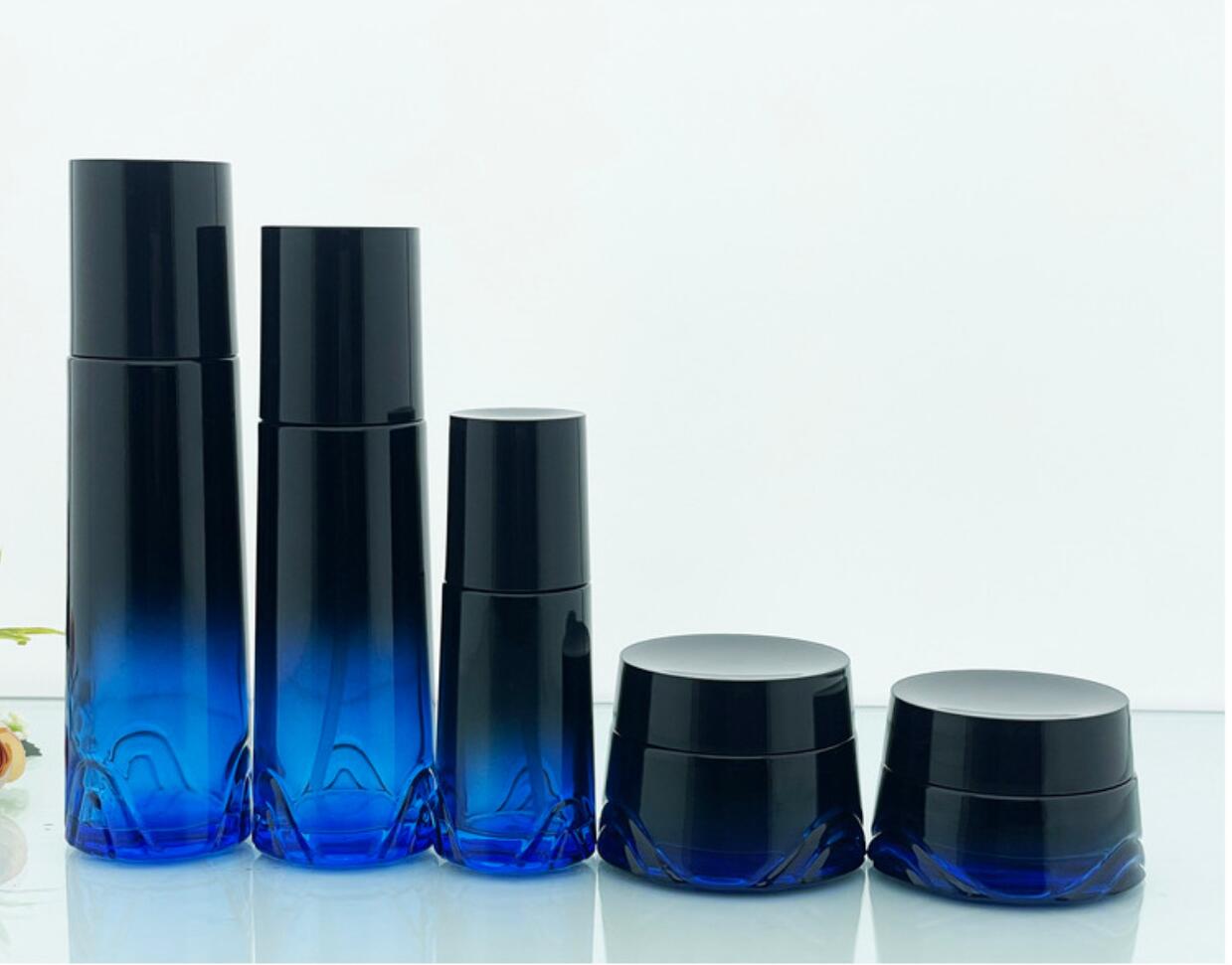 high quality luxury drak blue cosmetic glass bottle set cosmetic glass package wholeslale