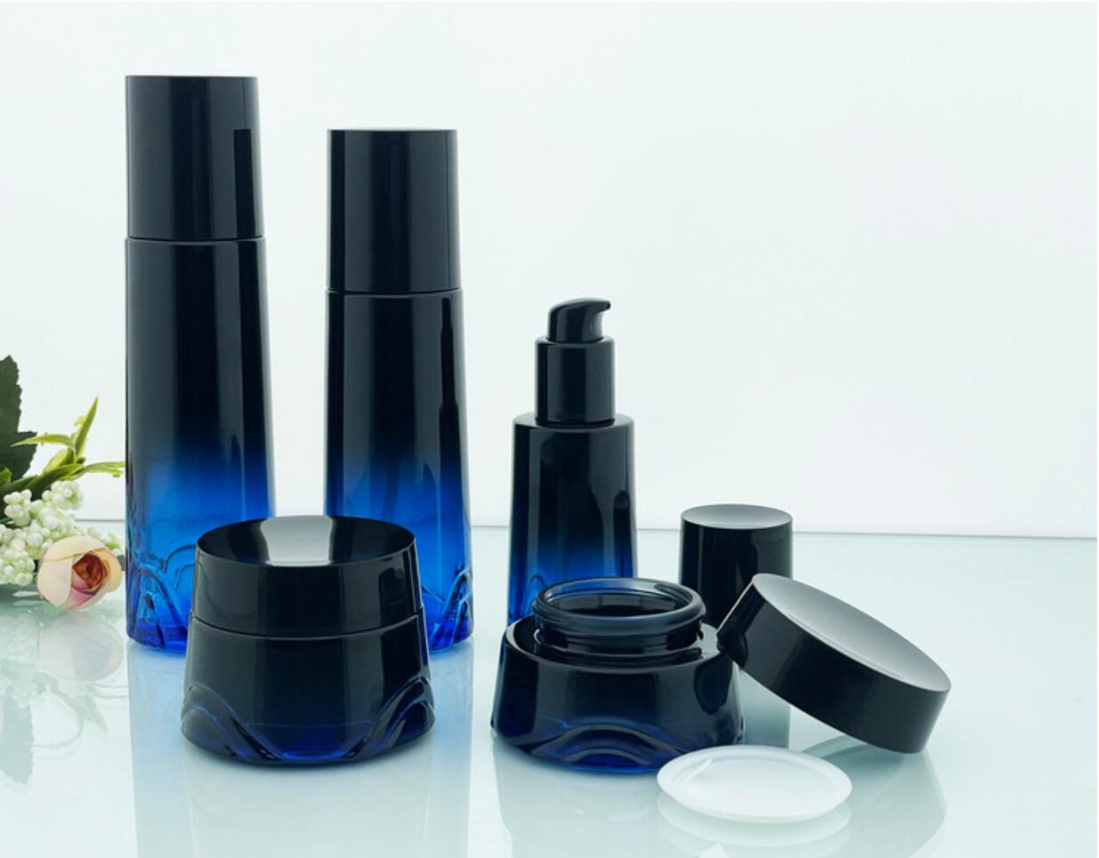 high quality luxury drak blue cosmetic glass bottle set cosmetic glass package wholeslale