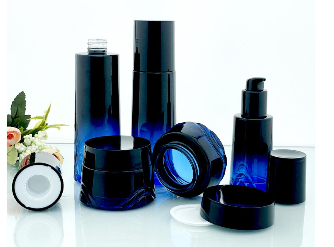 high quality luxury drak blue cosmetic glass bottle set cosmetic glass package wholeslale