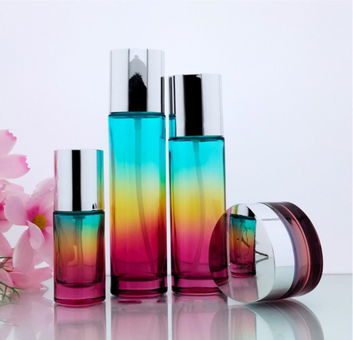 triangle colourful cosmetic packaging 30ml 100ml 120ml glass pump bottles and 50g skin facial cream jars with silver cap