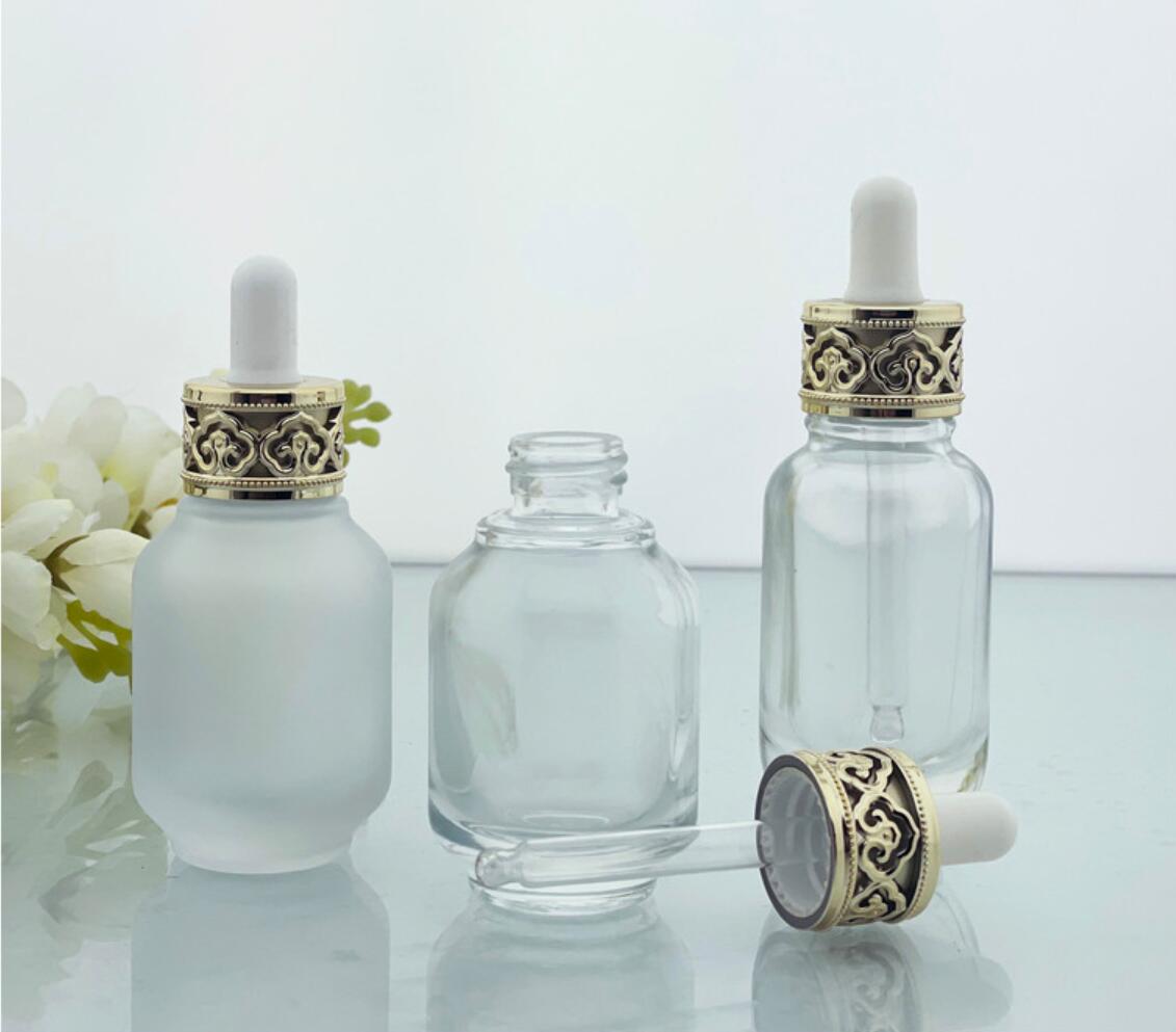 luxury 30ml 1 oz clear glass 30 ml cosmetic serum bottles with dropper cap gold white top for essential oil packaging