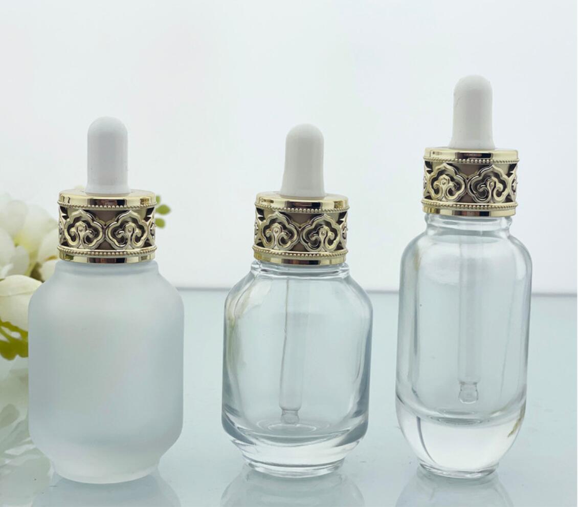 luxury 30ml 1 oz clear glass 30 ml cosmetic serum bottles with dropper cap gold white top for essential oil packaging