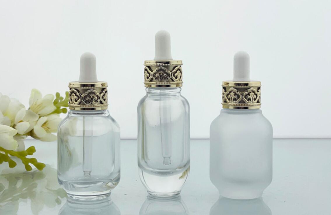 luxury 30ml 1 oz clear glass 30 ml cosmetic serum bottles with dropper cap gold white top for essential oil packaging